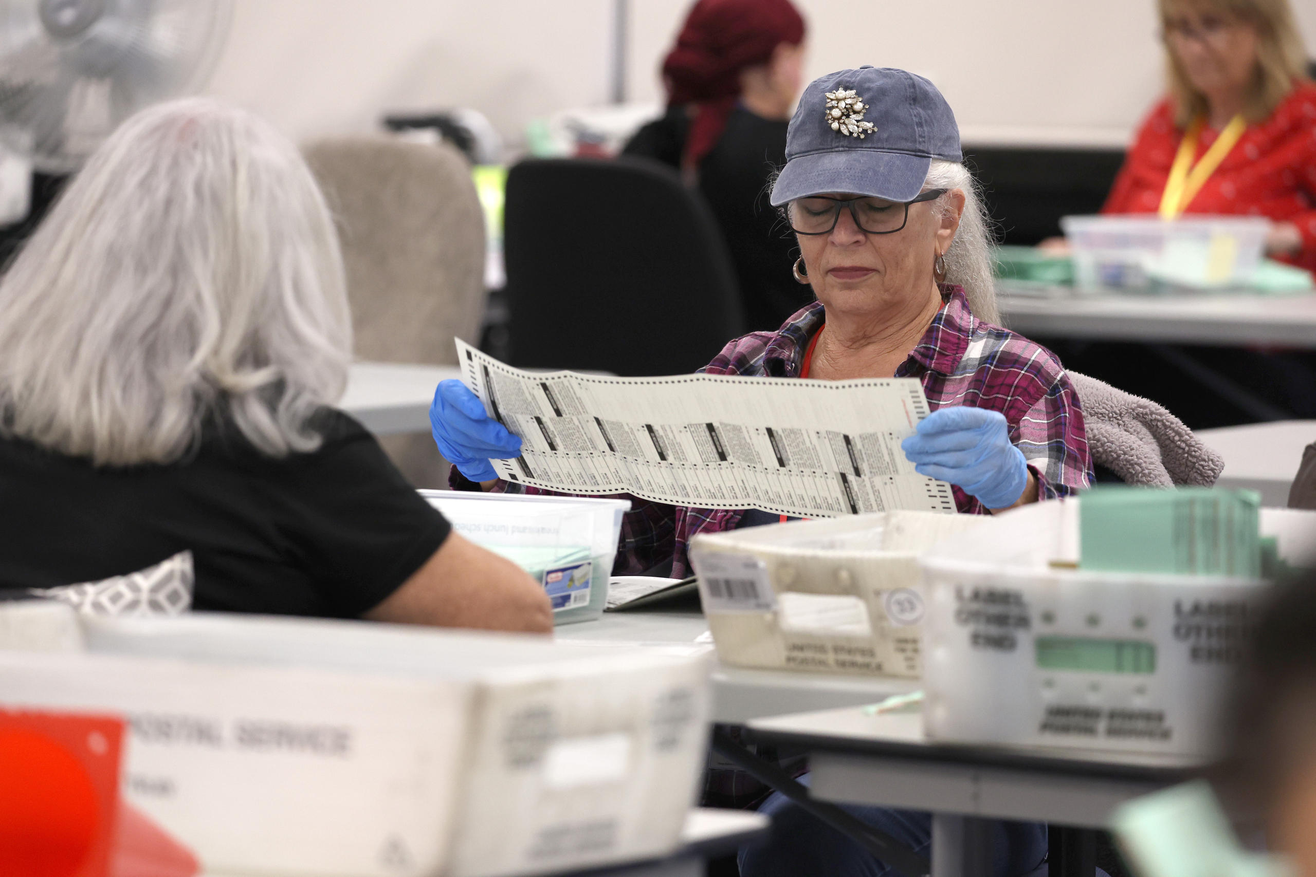 Election officials warn that widespread problems with the US mail system could disrupt voting