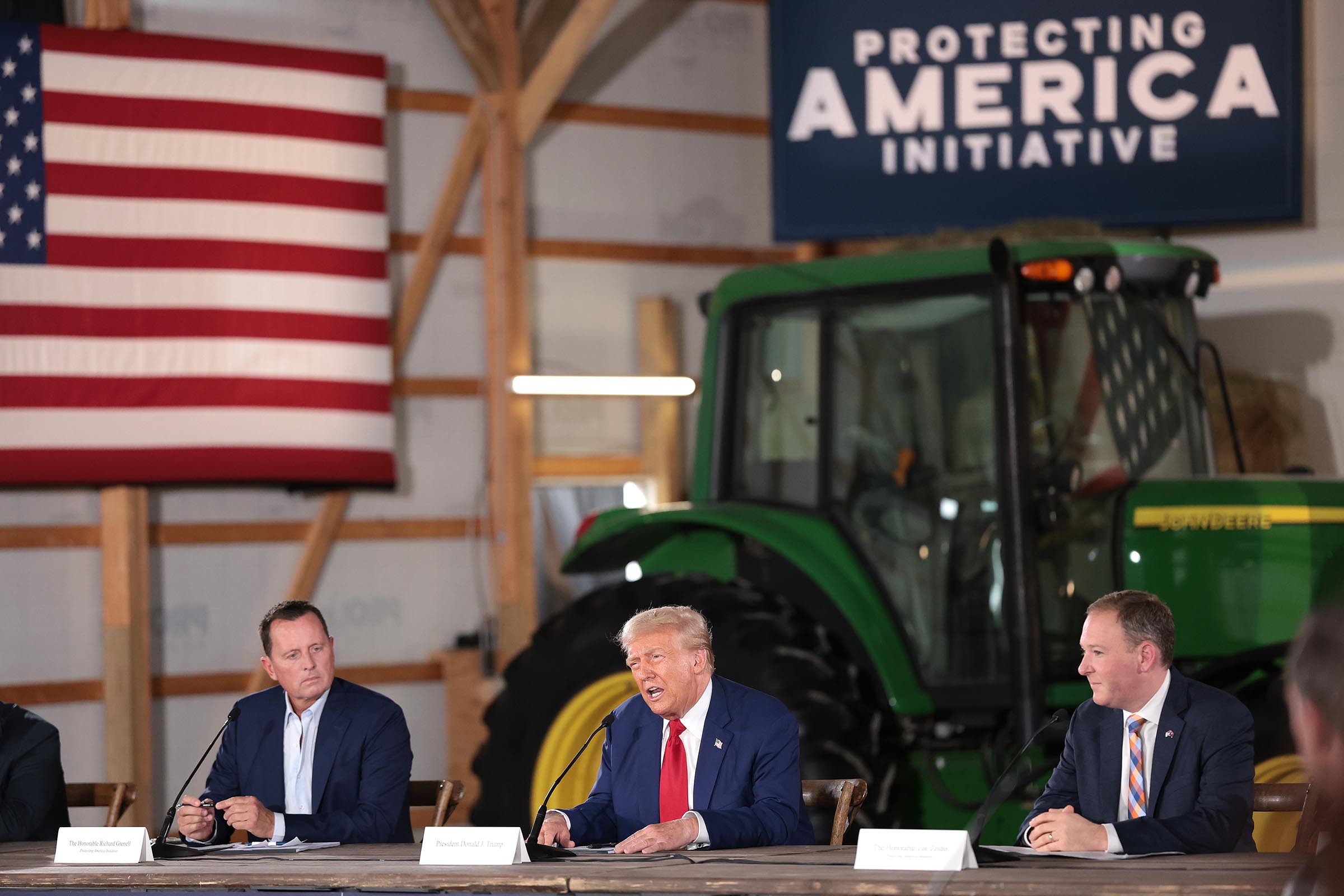 Trump listens during a farming event in rural Pennsylvania, then threatens John Deere with tariffs