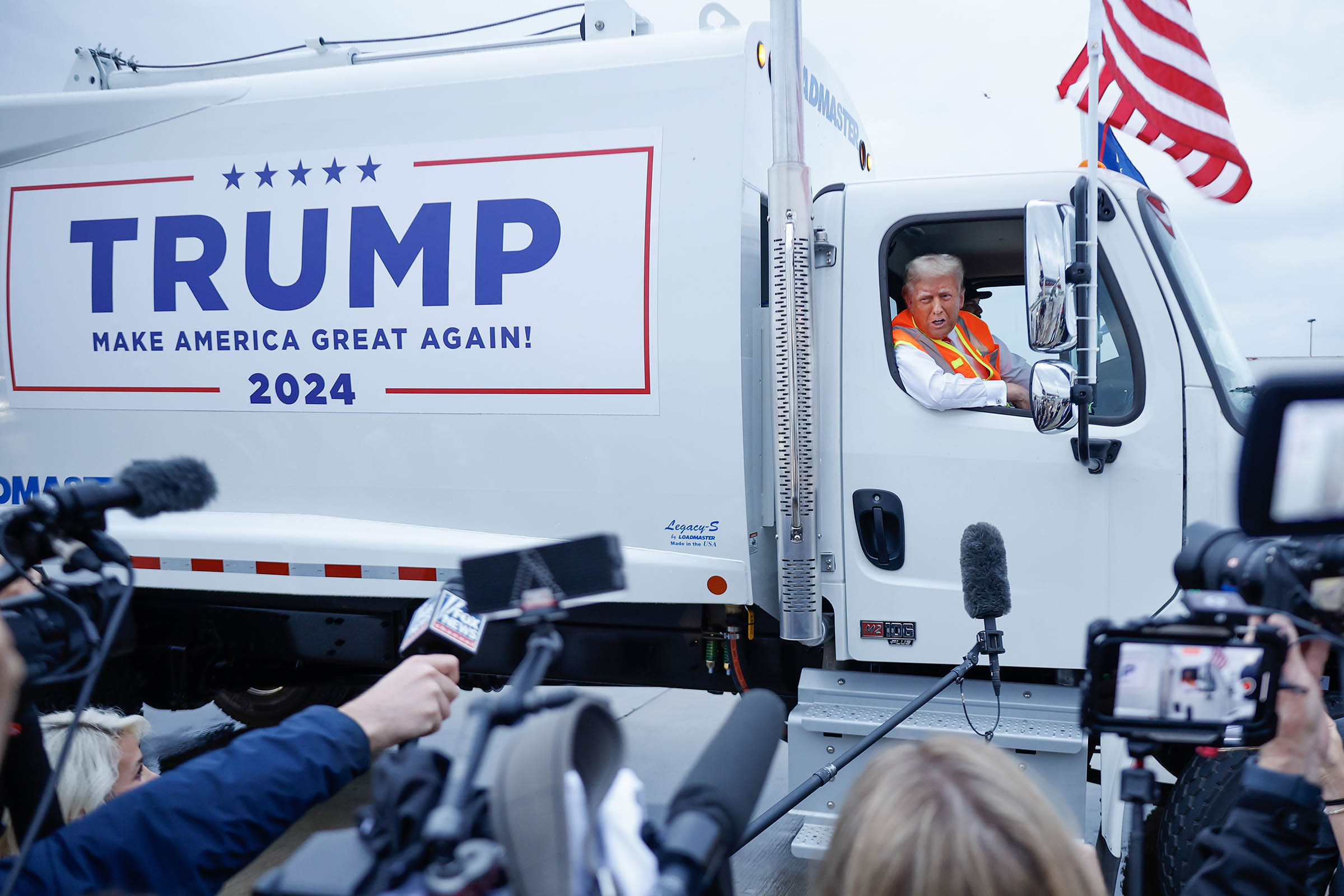 Donald Trump boards a garbage truck to draw attention to Biden remark