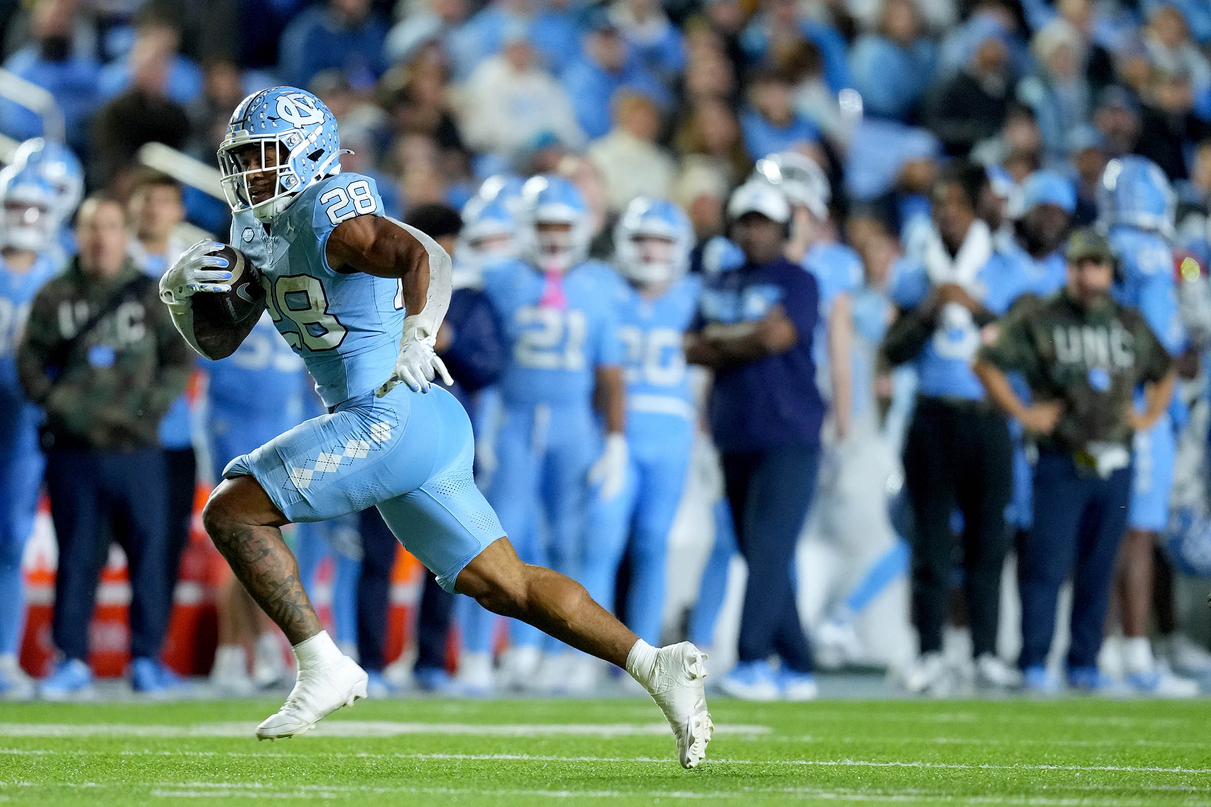 Hampton’s huge day helps North Carolina hold off Wake Forest 31-24 to reach bowl eligibility